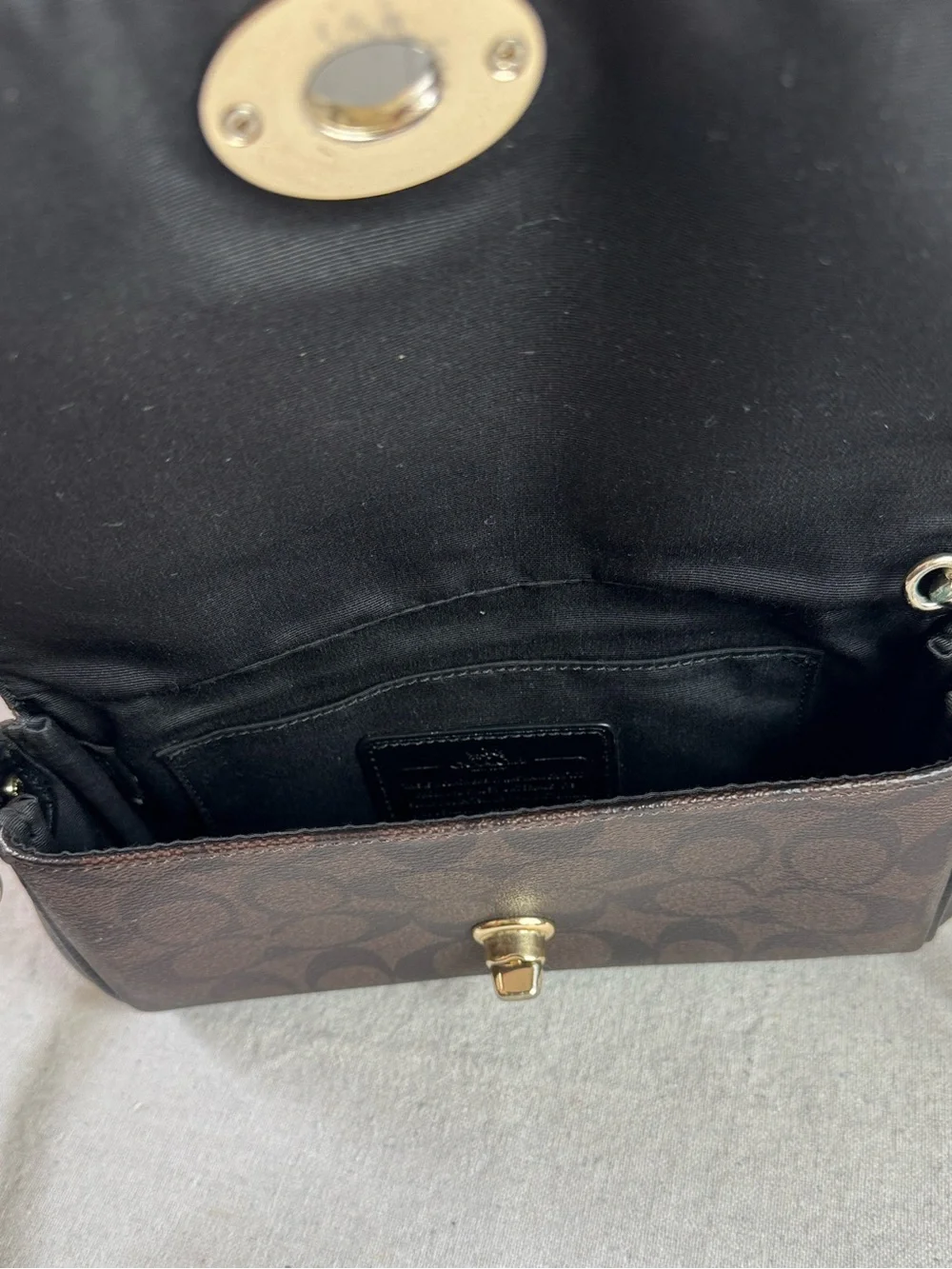 Coach Brown Signature Ruby Mini Crossbody with Gold Hardware bag.